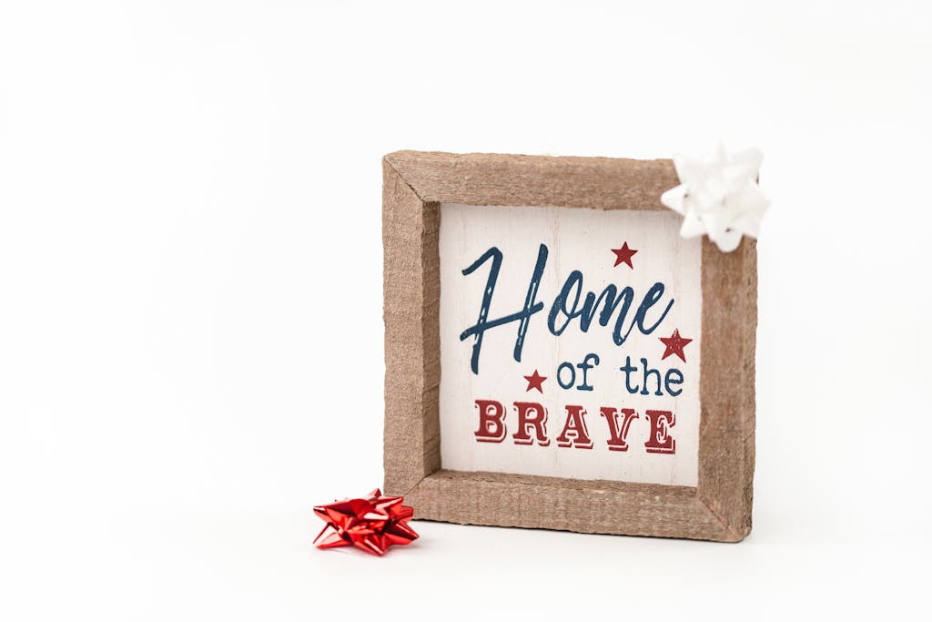 Home of the Brave Written on a Wooden Frame